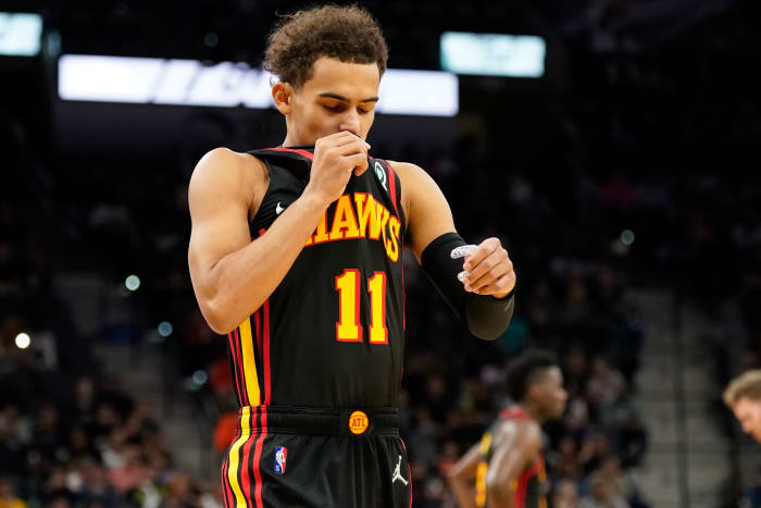 Atlanta Hawks guard Trae Young (11) kisses his uniform before the game against the San Antonio Spurs at AT&T Center.